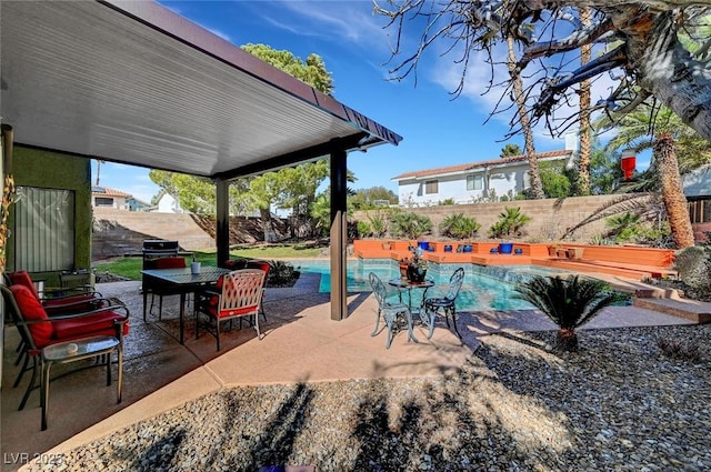 view of patio / terrace with a fenced in pool