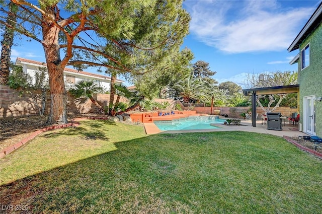 view of yard with a fenced in pool and a patio area