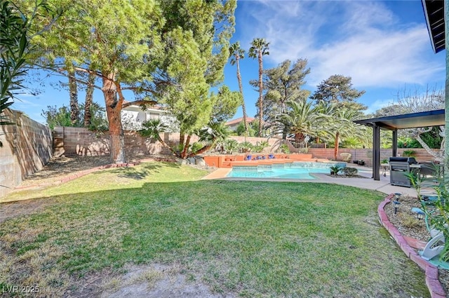 view of yard featuring a fenced in pool and a patio area