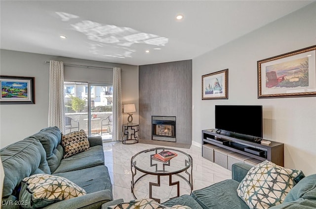 living room featuring a large fireplace