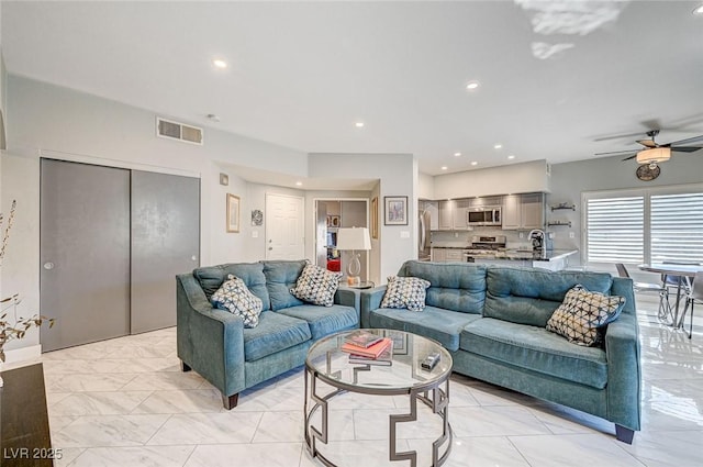 living room with ceiling fan