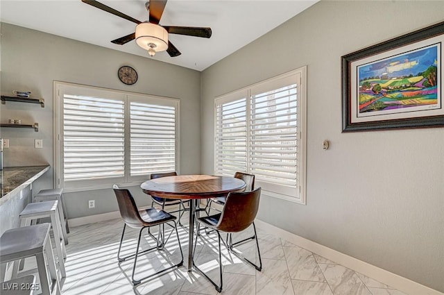 dining space with ceiling fan