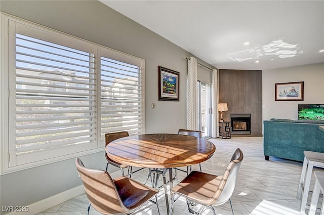 dining area featuring a fireplace