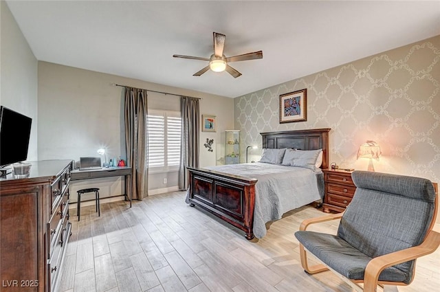 bedroom with ceiling fan and light wood-type flooring