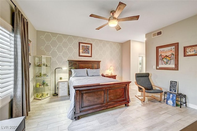 bedroom featuring ceiling fan and light wood-type flooring