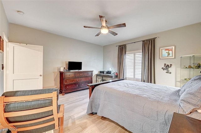 bedroom with ceiling fan and light hardwood / wood-style floors