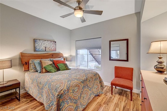 bedroom with ceiling fan and light hardwood / wood-style flooring