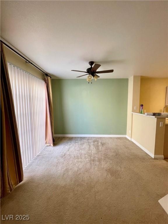 unfurnished living room with carpet floors and ceiling fan