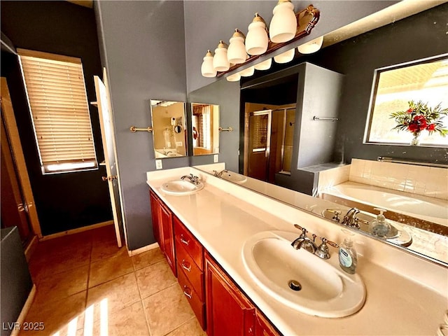 bathroom with tile patterned flooring, vanity, and a tub to relax in