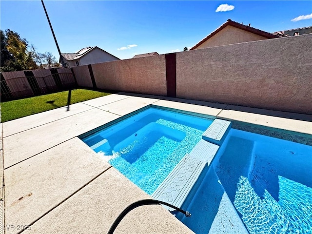 view of swimming pool with a patio and an in ground hot tub