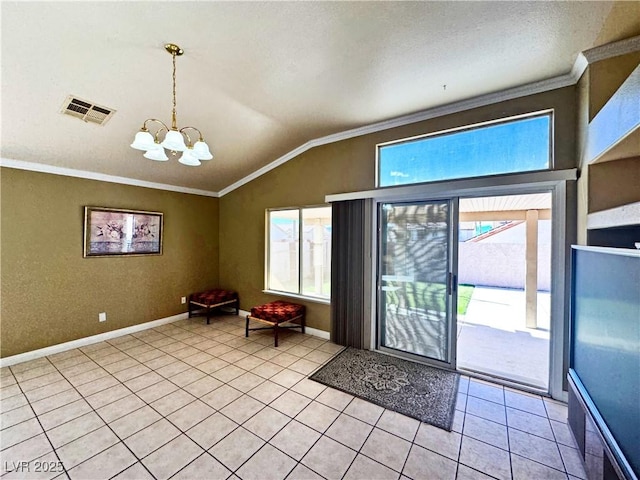 entryway featuring an inviting chandelier, light tile patterned floors, vaulted ceiling, and ornamental molding