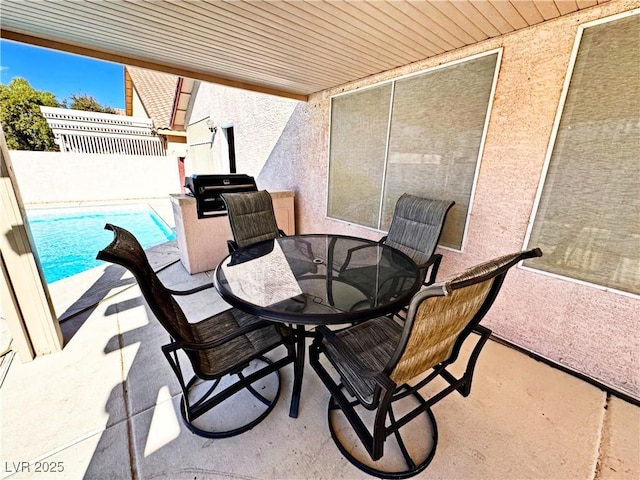 view of patio with a fenced in pool