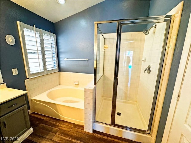 bathroom with hardwood / wood-style flooring and plus walk in shower