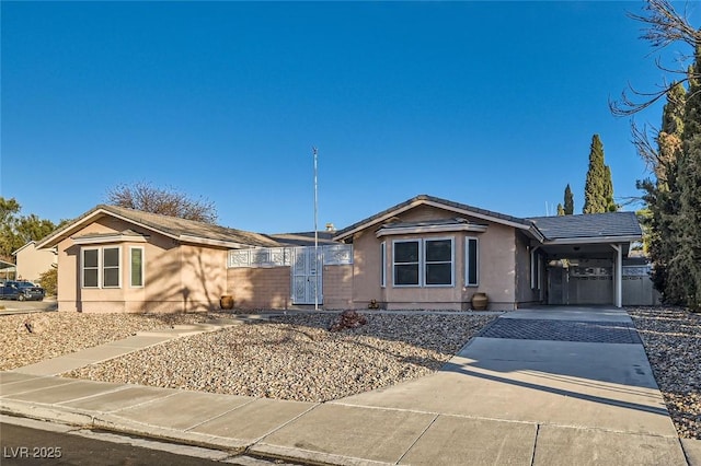 ranch-style home featuring a carport