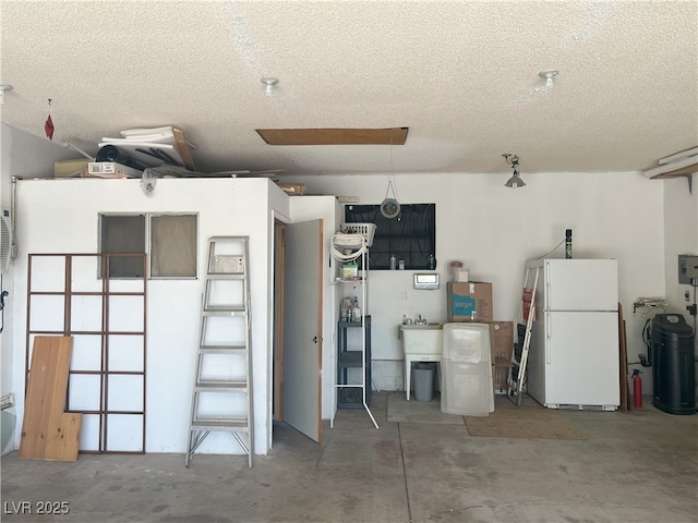 garage with freestanding refrigerator