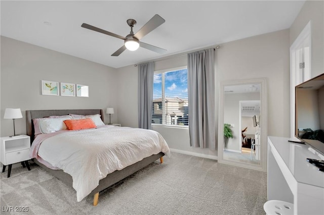 bedroom with light colored carpet and ceiling fan