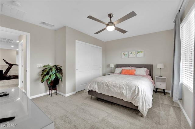 carpeted bedroom with ceiling fan