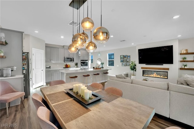 dining space featuring dark hardwood / wood-style floors