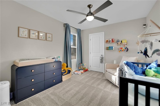 carpeted bedroom with ceiling fan