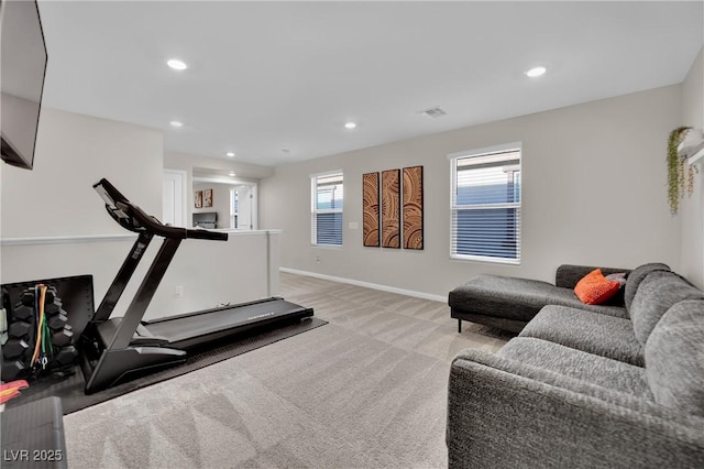 workout room with light colored carpet