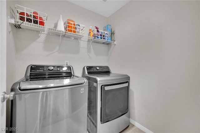 washroom featuring washer and dryer