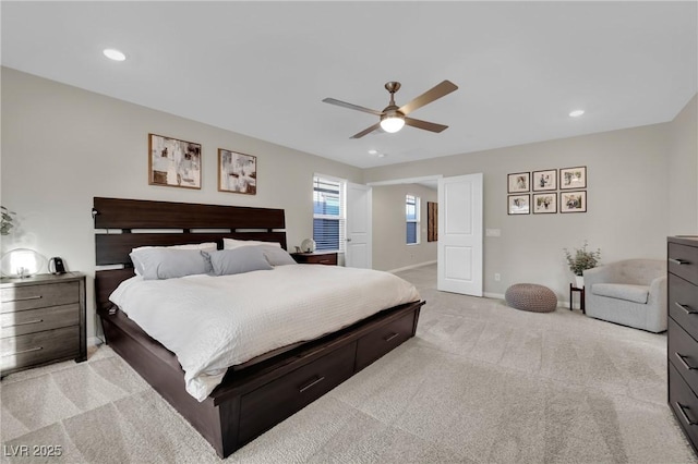 bedroom featuring ceiling fan and light colored carpet