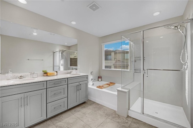 bathroom featuring vanity, tile patterned floors, and shower with separate bathtub