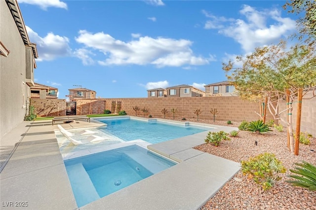 view of pool with an in ground hot tub