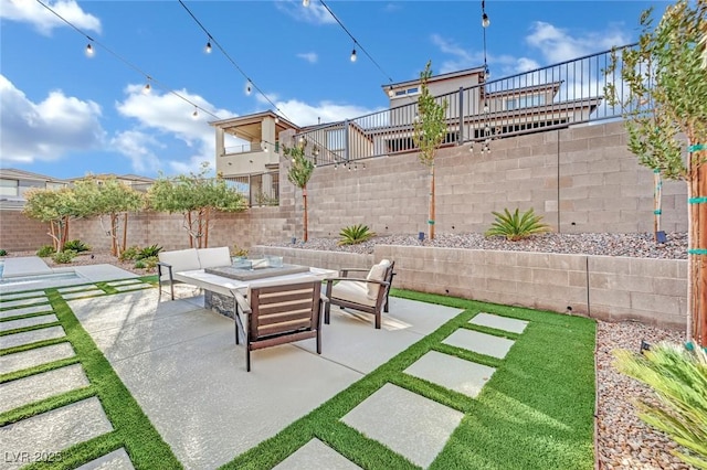 view of patio with an outdoor fire pit