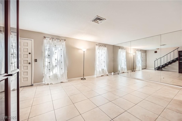 entrance foyer with light tile patterned floors