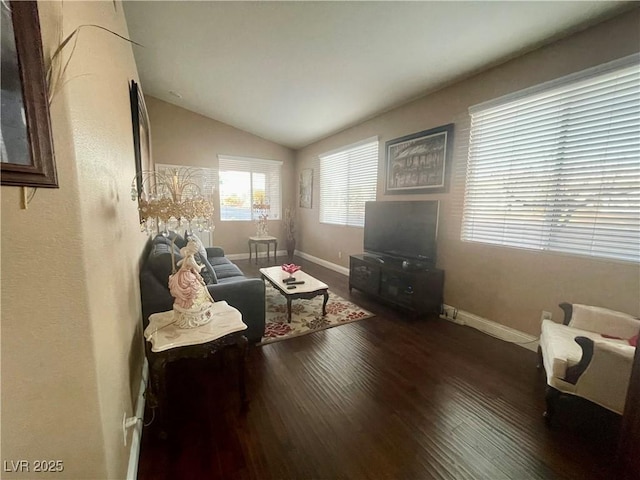 living room with lofted ceiling and dark hardwood / wood-style floors