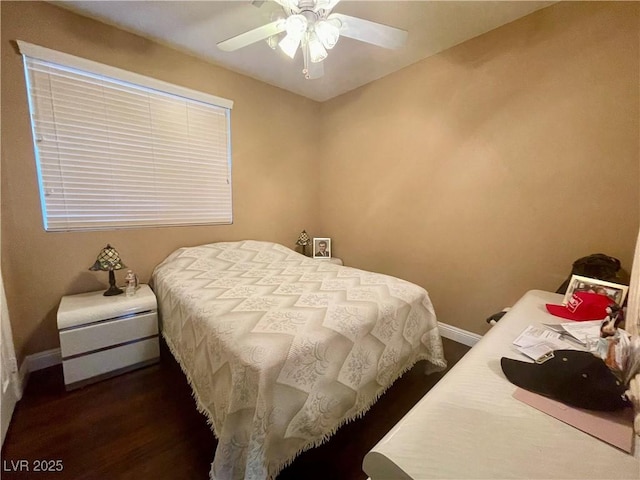 bedroom with ceiling fan and dark hardwood / wood-style flooring