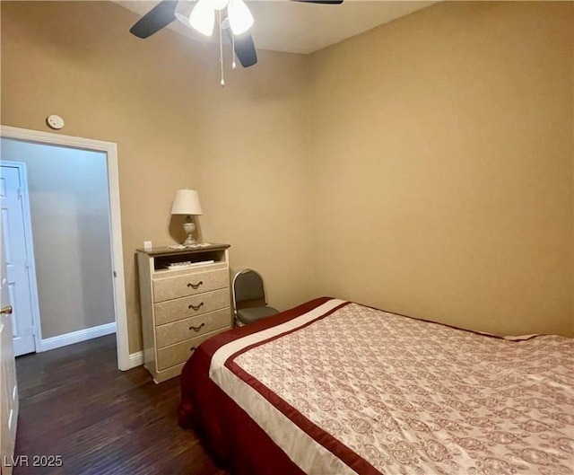 bedroom featuring dark hardwood / wood-style floors and ceiling fan