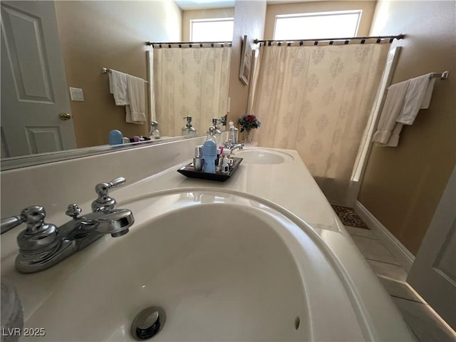 bathroom featuring vanity and a shower with shower curtain