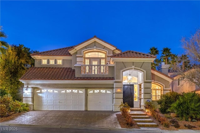 mediterranean / spanish house featuring a garage