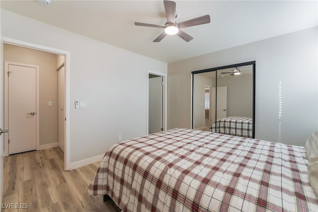 bedroom featuring ceiling fan, light hardwood / wood-style floors, and a closet