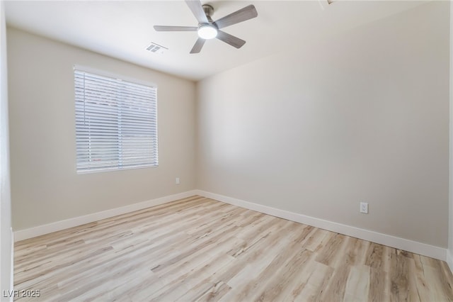 unfurnished room with ceiling fan and light hardwood / wood-style flooring