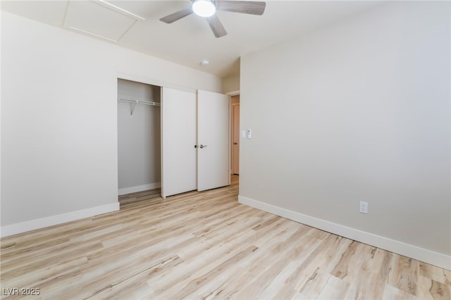 unfurnished bedroom with ceiling fan, light hardwood / wood-style floors, and a closet