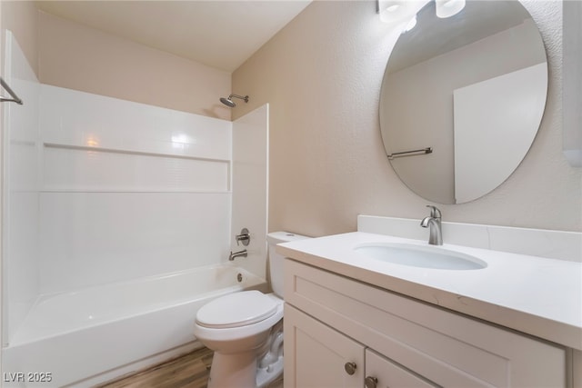 full bathroom featuring shower / bathtub combination, vanity, toilet, and hardwood / wood-style floors