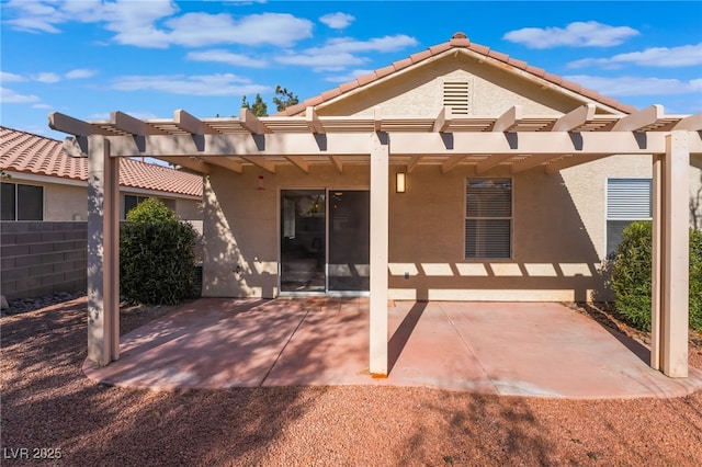 back of property with a patio area