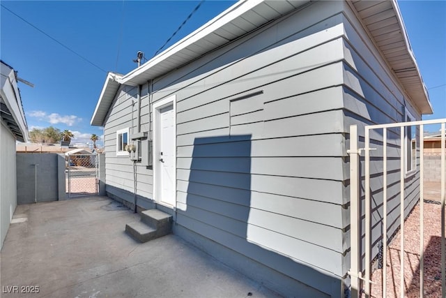 view of property exterior featuring a patio area