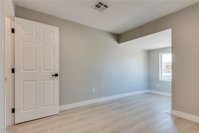 unfurnished room with light hardwood / wood-style floors