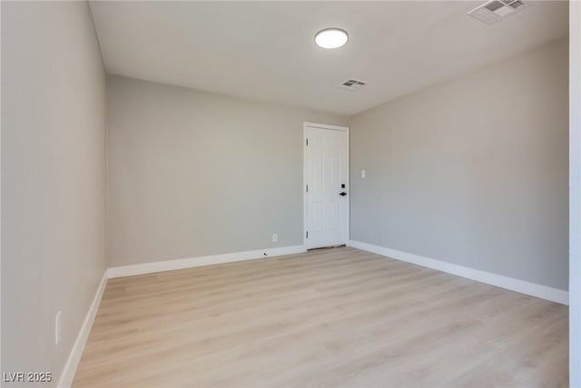 spare room with light wood-type flooring