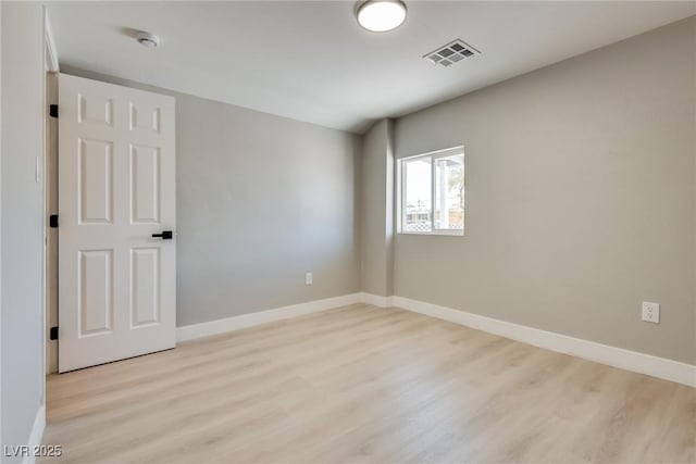 unfurnished room featuring light hardwood / wood-style flooring