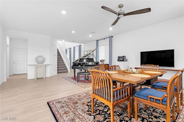 dining area with a ceiling fan, recessed lighting, and stairs