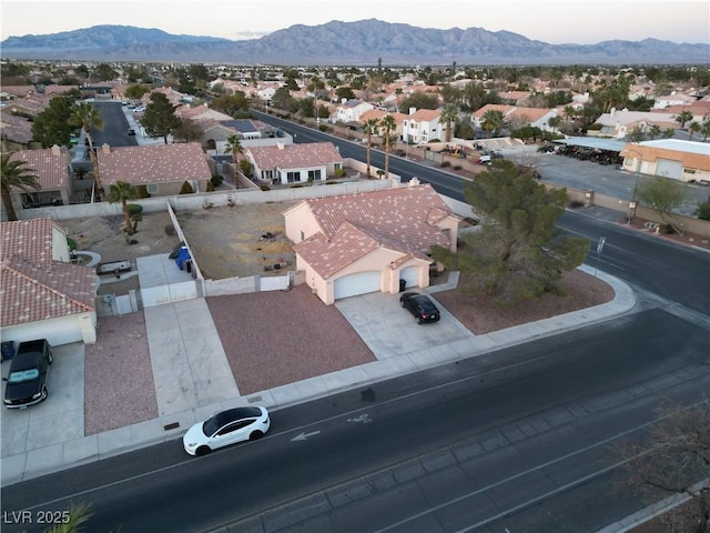 birds eye view of property with a residential view and a mountain view