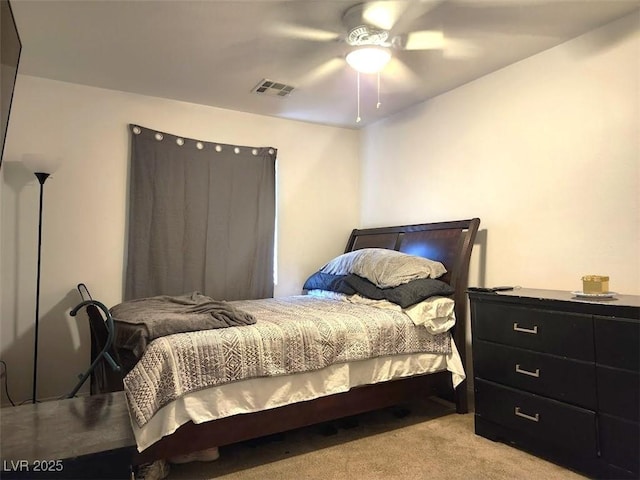 bedroom with light carpet and ceiling fan