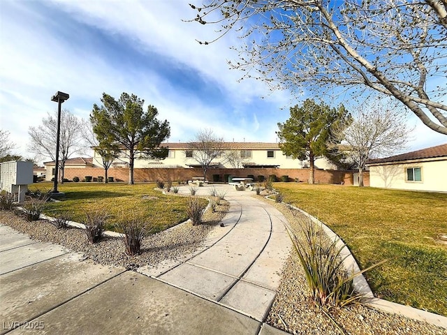 single story home featuring a front yard