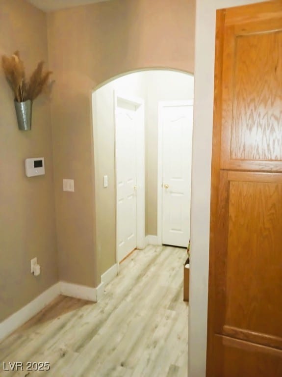 hall with light hardwood / wood-style flooring