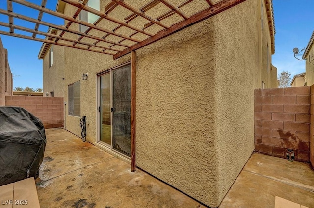 view of home's exterior featuring a patio and a pergola